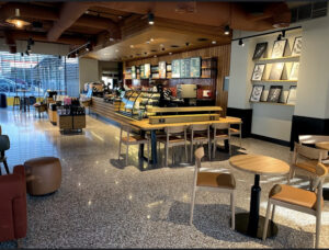 What makes terrazzo tiles a suitable choice for the hospitality industry?